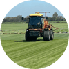 Photo of Greg Morgan spraying a field